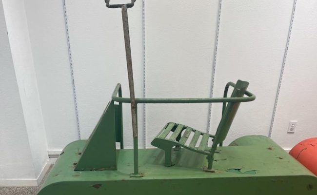 Green antique snowmobile